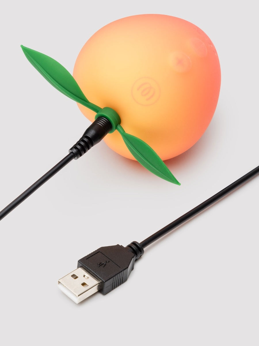 Womanizer Peach Toy stimulateur clitoridien