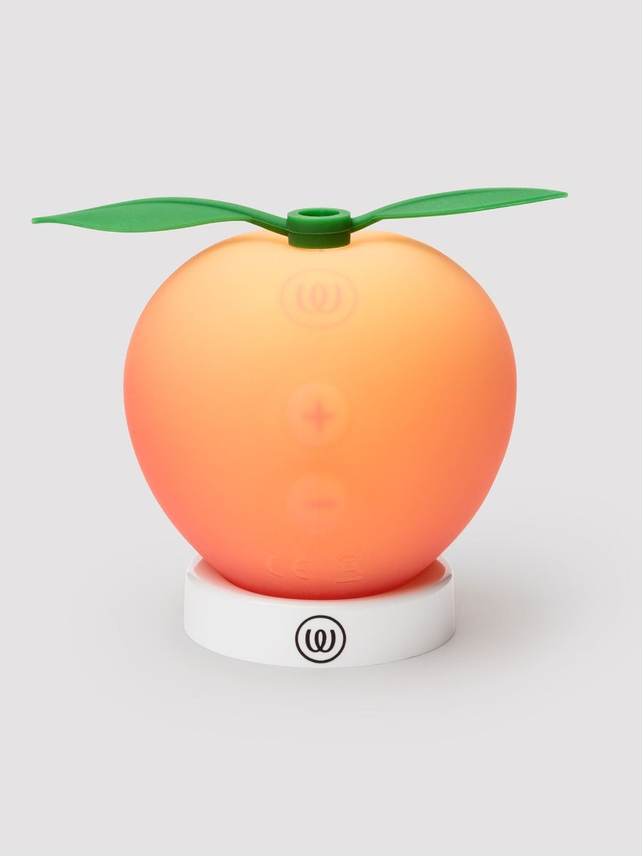 Womanizer Peach Toy stimulateur clitoridien